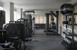 a gym with lots of treadmills and machines at LIVINGWAY Roco in Liverpool