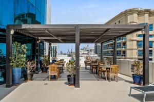 a patio with tables and chairs on a building at Furnished Apartment For Rent In Saba 3, Jlt in Dubai