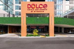 a building with a sign that reads duce with an entrance at Dolce by Wyndham Hollywood in Hollywood