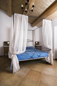 Säng eller sängar i ett rum på Agriturismo BelleBuono