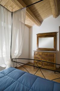 A bed or beds in a room at Agriturismo BelleBuono