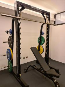a gym with a weight rack and weights at Best Western Plus Hotel De Capuleti in Verona