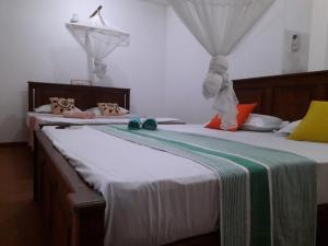Voodi või voodid majutusasutuse Sasagara Beach Villa toas