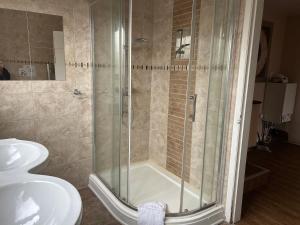 Ένα μπάνιο στο Guest Suite at The Grand Hotel