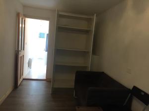 a living room with a couch and a book shelf at South Dublin Flat near Killiney Beach! in Loughlinstown
