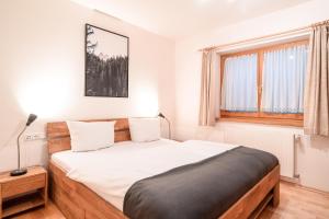 Postel nebo postele na pokoji v ubytování Alpenhaus Oberstdorf - Bergbahn unlimited inklusive