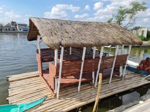 una cabaña en la parte superior de un muelle en el agua en Isla Fatima Private Resort, en Guagua