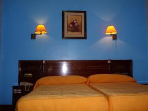 Postel nebo postele na pokoji v ubytování Hostal Centro Sol Madrid