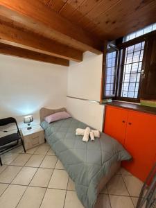 Posteľ alebo postele v izbe v ubytovaní La casa di “Nedda”