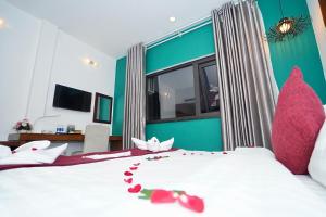 Postel nebo postele na pokoji v ubytování NT Elysian hotel