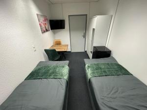 Tempat tidur dalam kamar di Pension Bavaria Immobilien