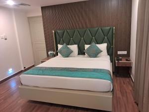 Säng eller sängar i ett rum på Hotel Grand Residence
