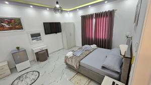 TV a/nebo společenská místnost v ubytování HOTEL Casa Vacanze SHIROKE + 37 fotografií