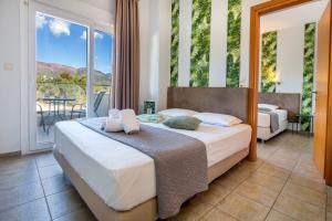 Postel nebo postele na pokoji v ubytování Hotel Discovery Thassos