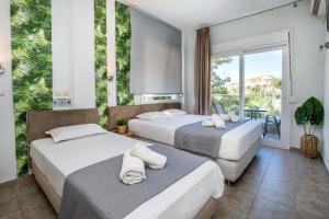 Postel nebo postele na pokoji v ubytování Hotel Discovery Thassos