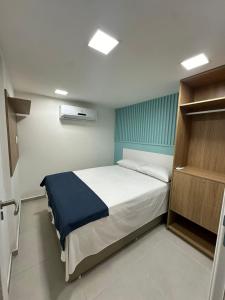Ein Bett oder Betten in einem Zimmer der Unterkunft SUNNY HALL, FLAT COM TRÊS QUARTOS