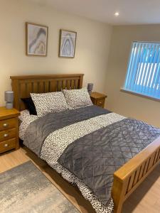 a bedroom with a large bed and a window at Beldorny in Kingston