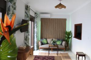 a living room with a couch and a table at Tropical Old Town Marbella in Marbella