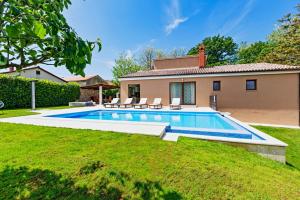 a swimming pool in the yard of a house at Villa Ferlini in Central Istria with private 10000 m2 Garden in Svetvinčenat