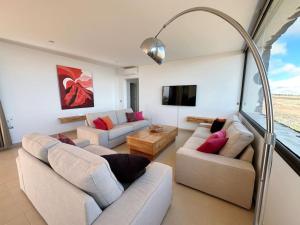 a living room with two couches and a tv at Villa with views and Villaverde in Villaverde