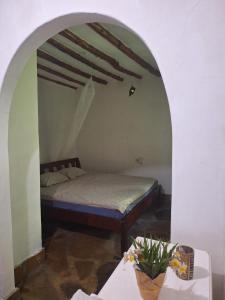เตียงในห้องที่ Villascape Malindi Private Rooms in villa