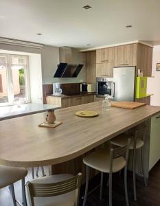 a kitchen with a large wooden table and chairs at Appartement de 2 chambres avec terrasse amenagee et wifi a Mittlach in Mittlach