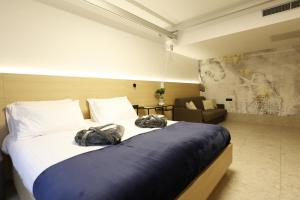 Postel nebo postele na pokoji v ubytování FLORAMARE HEALTH RESORT