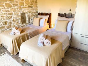 Villa Taf - Kreta tesisinde bir odada yatak veya yataklar