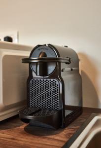 a black toaster sitting on top of a counter at Lycabettus View in Athens