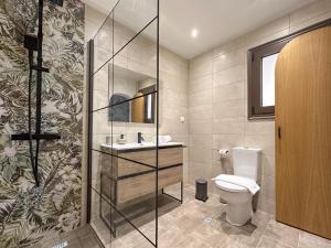 a bathroom with a toilet and a sink at Stellas Village House in Myrtia