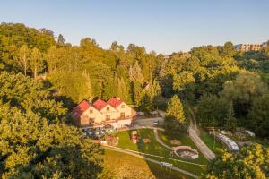 an aerial view of a house in the middle of a forest at Penzion U Hráze in Luhačovice