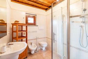 A bathroom at Tuscan Sun With Shared Pool - Happy Rentals