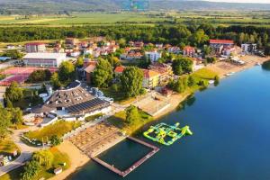 an aerial view of a small town on the river at Apartmani Royal in Veliko Gradište
