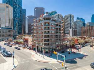 an intersection in a city with a tall building at BowRiver view downtown 2 bedroom Downtown Calgary in Calgary