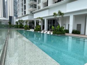 The swimming pool at or close to Quill Residences Suite