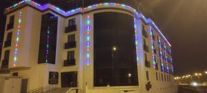 a building with christmas lights on it at night at Efe Termal in Kütahya