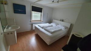Postel nebo postele na pokoji v ubytování Bungalow Uthof