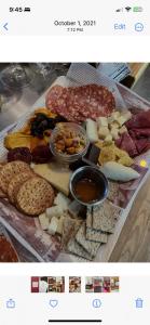 a display of different types of cheese and meats at En Suite Flora in Dripping Springs