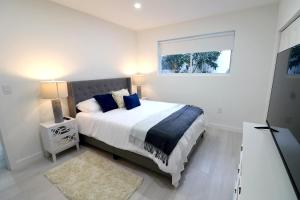 Ένα ή περισσότερα κρεβάτια σε δωμάτιο στο Villa Cristina in Miami +19 φωτογραφίες