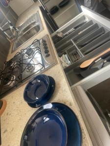 two blue plates sitting on a counter in a kitchen at Furnished house of Véranda groupe in Niamey