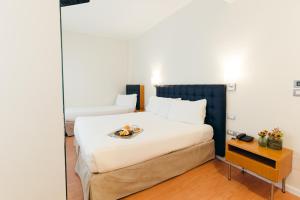 Postel nebo postele na pokoji v ubytování Hotel Excelsior Bari + 37 fotografií