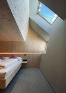 Rúm í herbergi á Hideaway Planneralm operated by JUFA Hotels