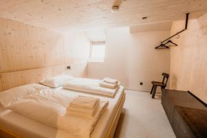 Rúm í herbergi á Hideaway Planneralm operated by JUFA Hotels