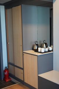 a kitchen with a counter with pots and pans at Sacheon Grand Tourist Hotel in Sacheon