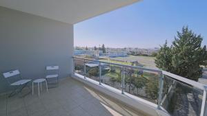 a balcony with a view of a city at STAY Skyline Nest in Larnaka