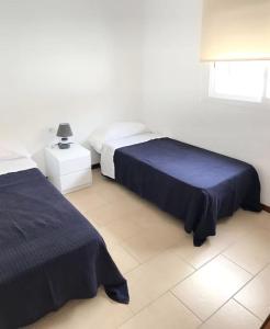 Ένα ή περισσότερα κρεβάτια σε δωμάτιο στο Chalet en C.Vadella - Piscina privada