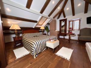 a bedroom with a bed and a living room at Villa Anica Dubrovnik - luxurious with a sea view in Dubrovnik