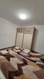 Postel nebo postele na pokoji v ubytování Anamarija apartmani + 6 fotografií