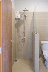 a shower in a bathroom with a toilet at Nymph Hideout in Koh Phangan