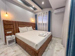 Postel nebo postele na pokoji v ubytování Rumani 3 Islands Hotel
